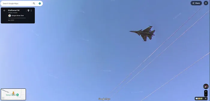 A military jet flying high in the sky, captured in a funny Google Street View photo.