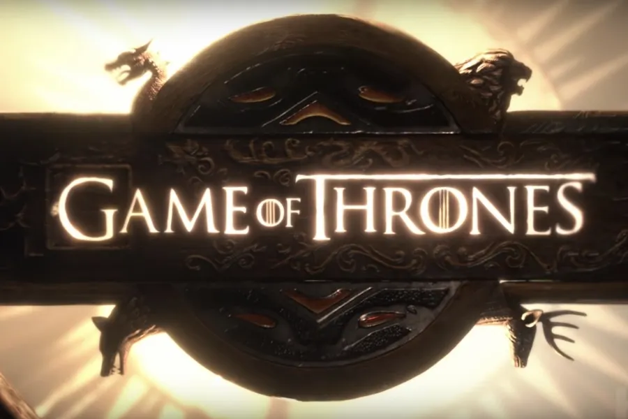 The ornate, glowing Game of Thrones logo with mythical creatures.