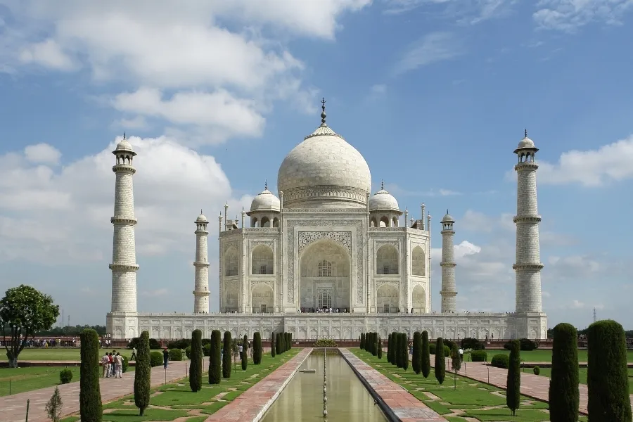 The Taj Mahal, a grand white marble mausoleum, with reflecting pool, was completed.