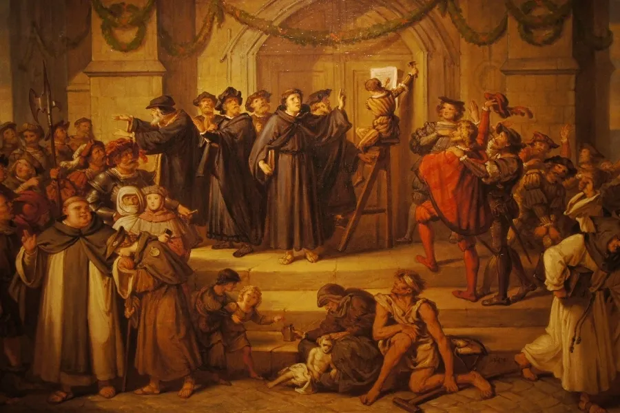 Painting of Martin Luther posting his 95 Theses on a church door, surrounded by a crowd.
