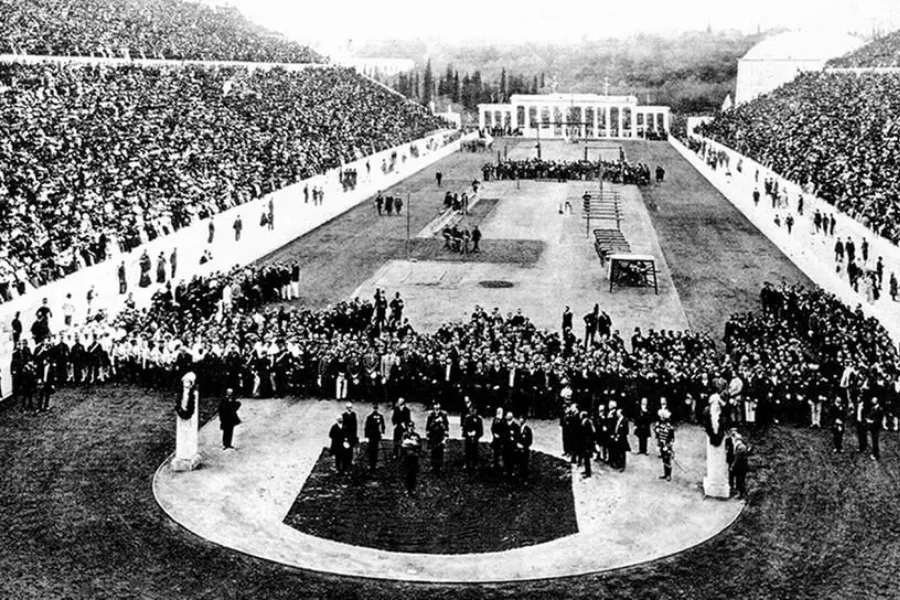 An aerial view of the first modern Olympic Games stadium filled with spectators and athletes.