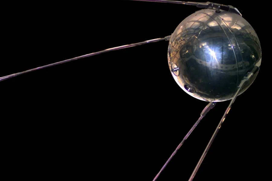 A close-up of Sputnik 1, the first artificial satellite, against a black background, representing the launch of Sputnik 1.