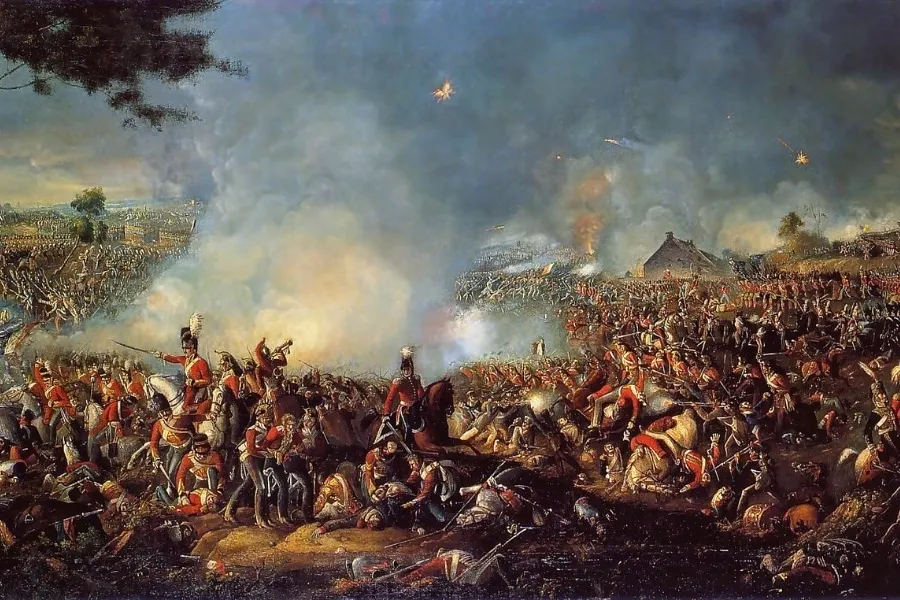 A chaotic painting depicts the Battle of Waterloo, with soldiers fighting amidst smoke and cannons firing, illustrating the intense conflict.