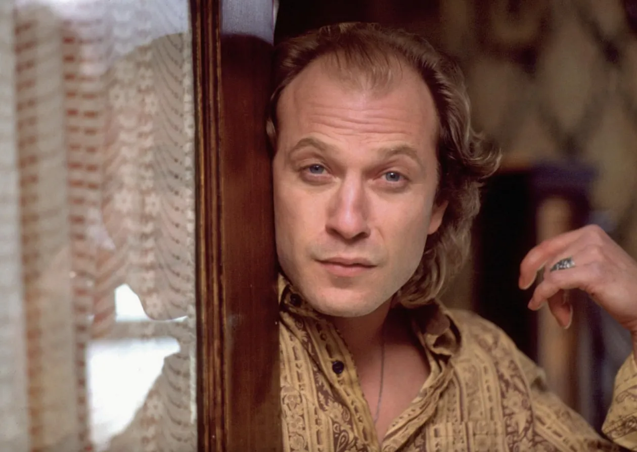 Buffalo Bill from The Silence of the Lambs, looking intently, ideal for 80s & 90s movie trivia.