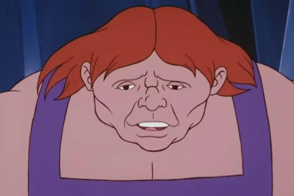 A cartoon image of a man with red hair and a purple shirt, asking to identify the character from He-Man.