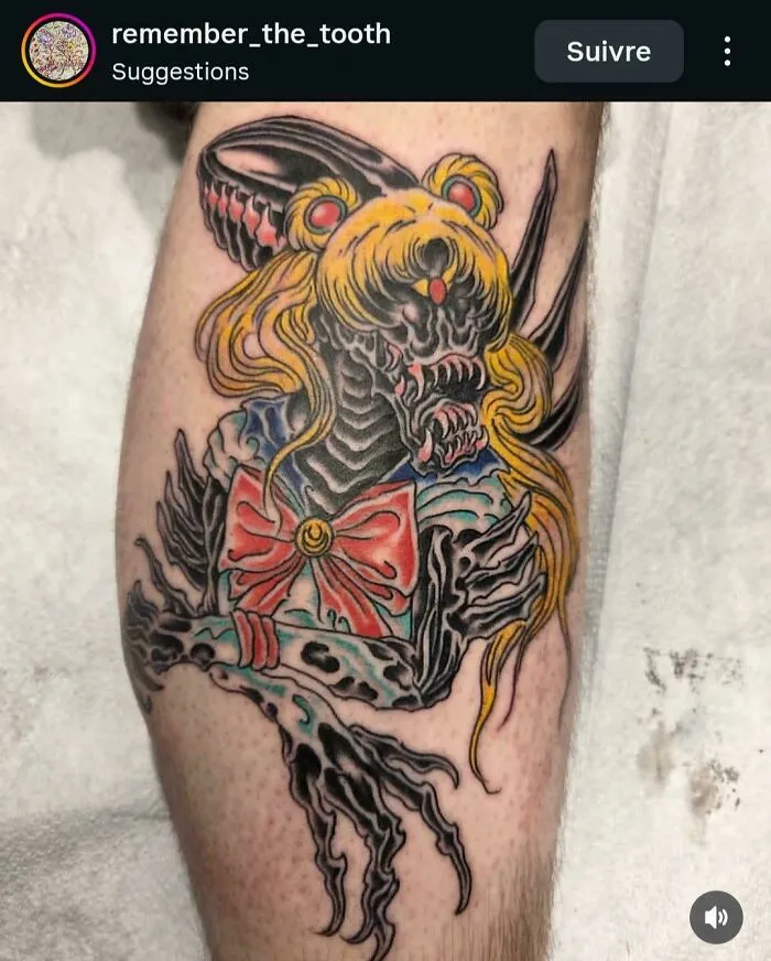 A detailed tattoo of an Alien-Sailor Moon hybrid with sharp claws and teeth, demonstrating a tattoo artist's talent.
