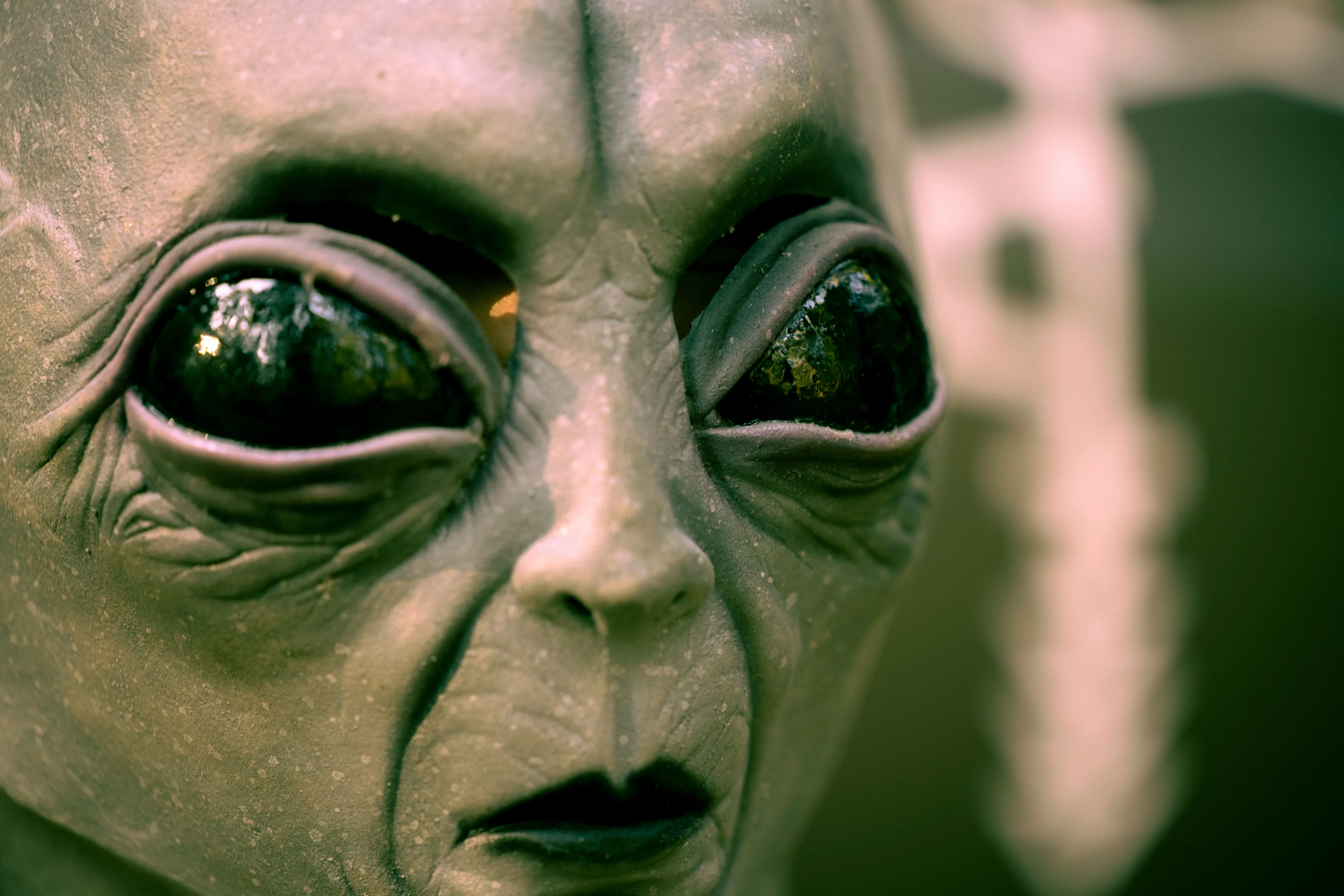 Close-up of an alien head, hinting at the conspiracy theory that Area 51 holds alien life.