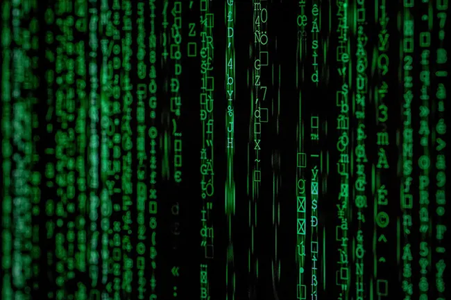 Green binary code on a black screen, suggesting the idea that we are living in a simulation.