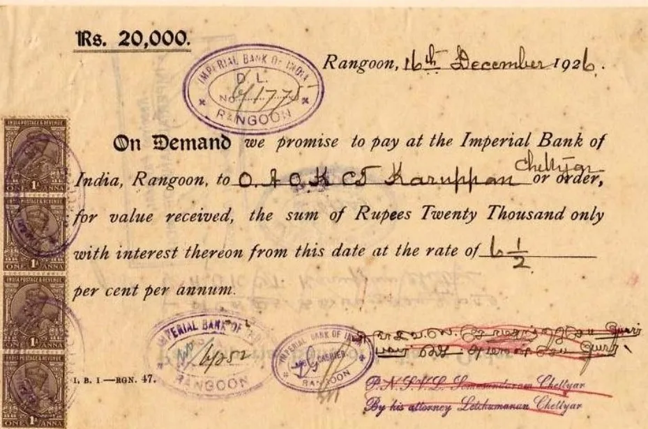 A historical Promissory Note for Rs. 20,000 from Rangoon, dated December 16, 1926, with revenue stamps and bank seals.