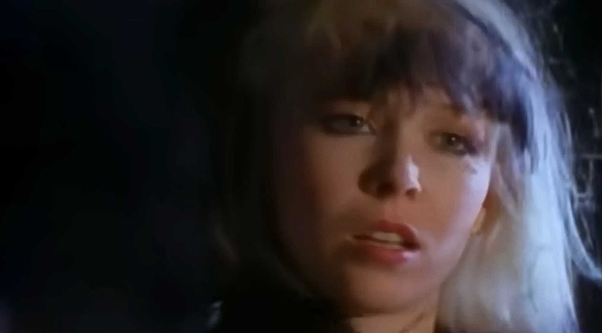 A close-up of a female singer from the band Berlin, known for her iconic hit Take My Breath Away.