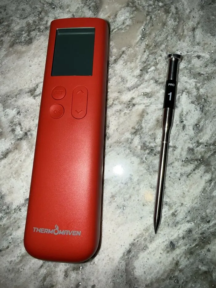 A red ThermoMaven meat thermometer and probe, an excellent last minute Fathers Day gift for grill masters.