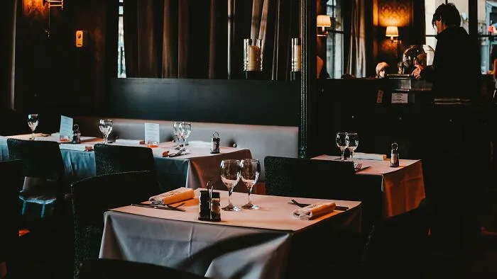 Your date insists on taking you to an incredibly expensive, exclusive restaurant for a casual first meeting. They dismiss your suggestions for a low-key coffee or drink, stating they only enjoy high-end experiences. They pay for everything without letting you look at the price.