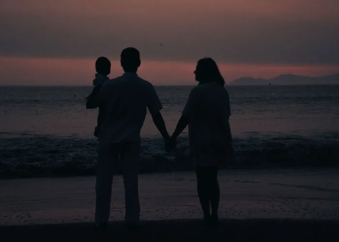 Family watching sunset, contrasting the fate of popular kids who peaked in high school