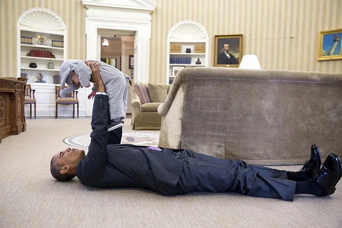 President Barack Obama Holds Ella Harper Rhodes