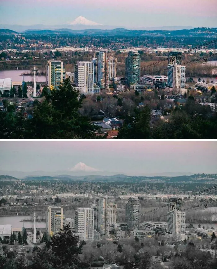 Urban hell cityscape with high-rise buildings and distant mountains at dusk