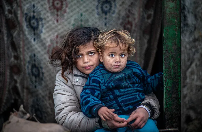 Holding On To Each Other By Abdelrahman Alkahlout