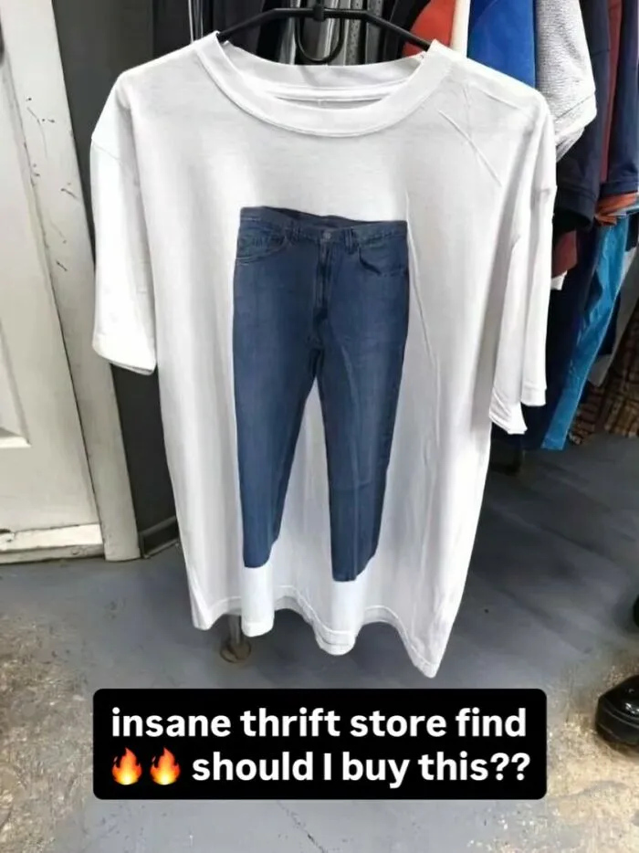 White t-shirt with fake jeans printed and humorous thrift store find text
