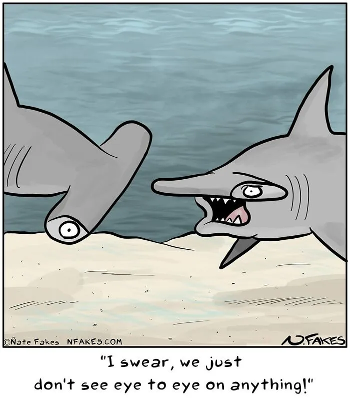 Funny comic with hammerhead sharks not seeing eye to eye underwater