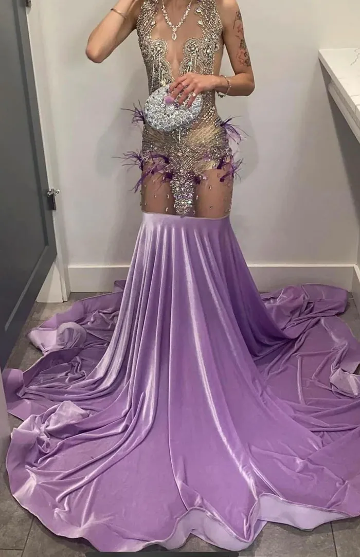 Fashion design fail with sheer dress and awkward embellishments