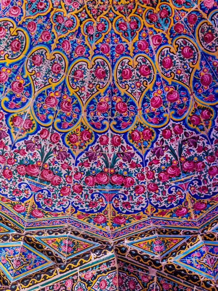 Persian floral tilework ceiling with pink and blue intricate patterns