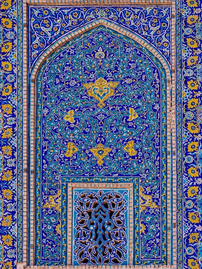 Detailed Persian tile mosaic with blue background and complex floral geometry