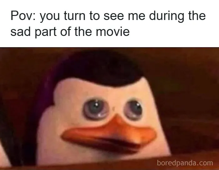 Sad penguin character from movie, turning to look during emotional scene