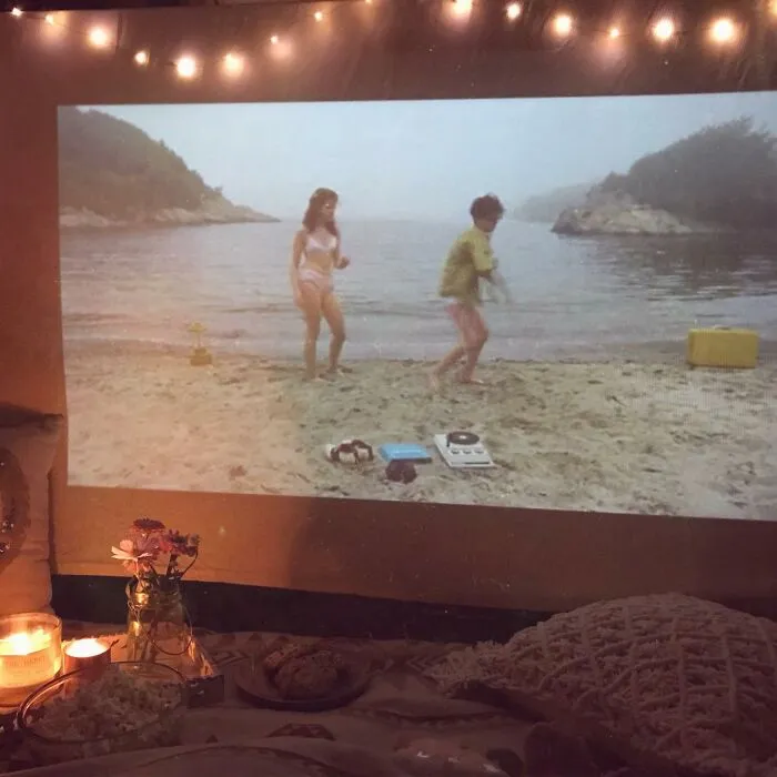 Turning Any Wall, Backyard Fence, Or Bedsheet Into A Movie Screen At A Moment's Notice Is Exactly The Kind Of Energy A <a Style="Display:inline;" Href="Https://Www.amazon.com/Dp/B076q3gbjk?ots=1&slotnum=101&imprtoken=aec61a8e-D598-4668-801&ascsubtag=%5bartid%7c10055.g.27116208%5bsrc%7c%5bch%7c%5blt%7c%5bpid%7cff071aab-E71f-4f16-80f2-Ef16a4608b24&th=1&linkcode=ll1&tag=bpdolphin-20&linkid=fb7b3ccf9c2b21325336ceb2f6c292ab&language=en_us&ref_=as_li_ss_tl" Target="_blank">  <span Style="Font: Inherit; Color: #d74b1f;"> Portable Projector </Span> Brings To A Dad Who Thinks The Living Room TV Is Just A Starting Point