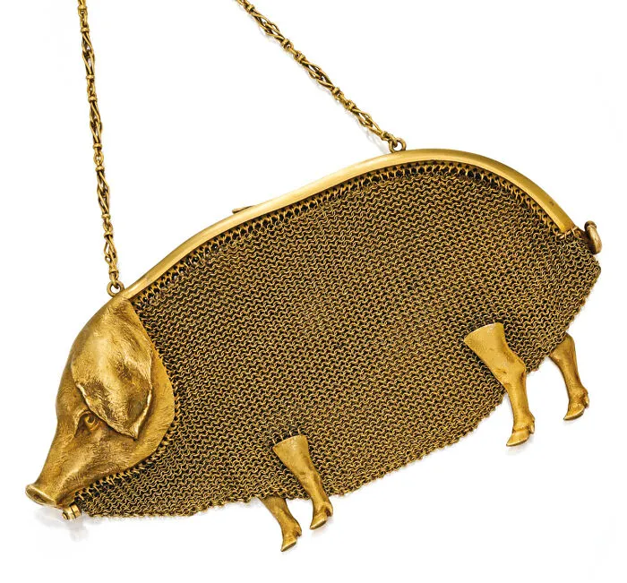 A gold pig-shaped chainmail purse, one of many interesting objects that are still intact after all these years.