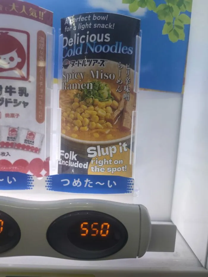 A vending machine ad in Japan for "Spicy Miso Ramen" with the instruction "Folk Slup it right on the spot!" showing lost in translation.