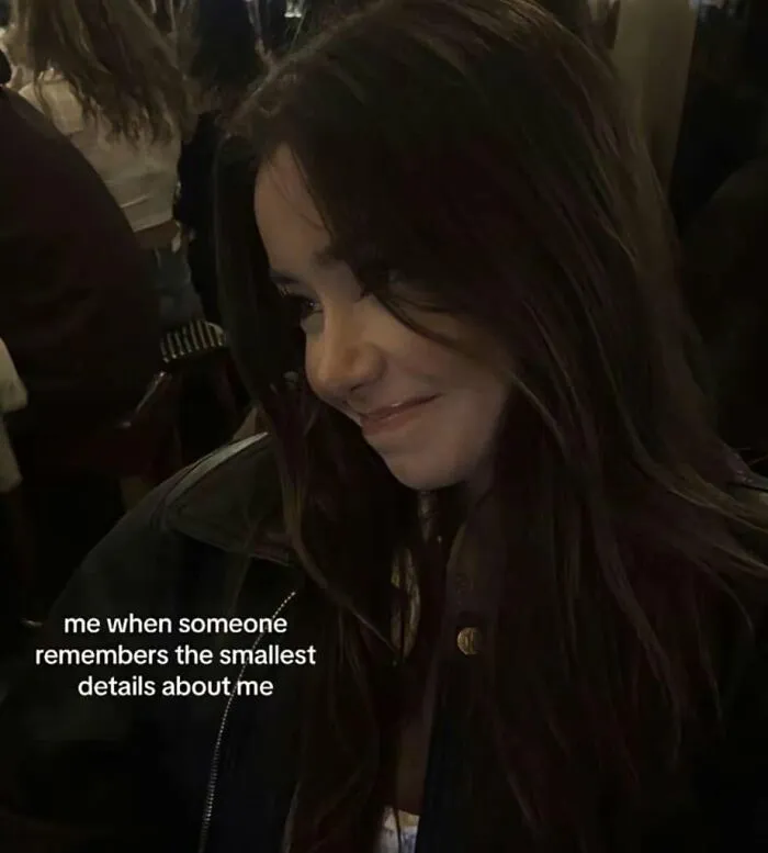 Funny post about what being a woman is really like, a smiling woman reacting to remembered details.