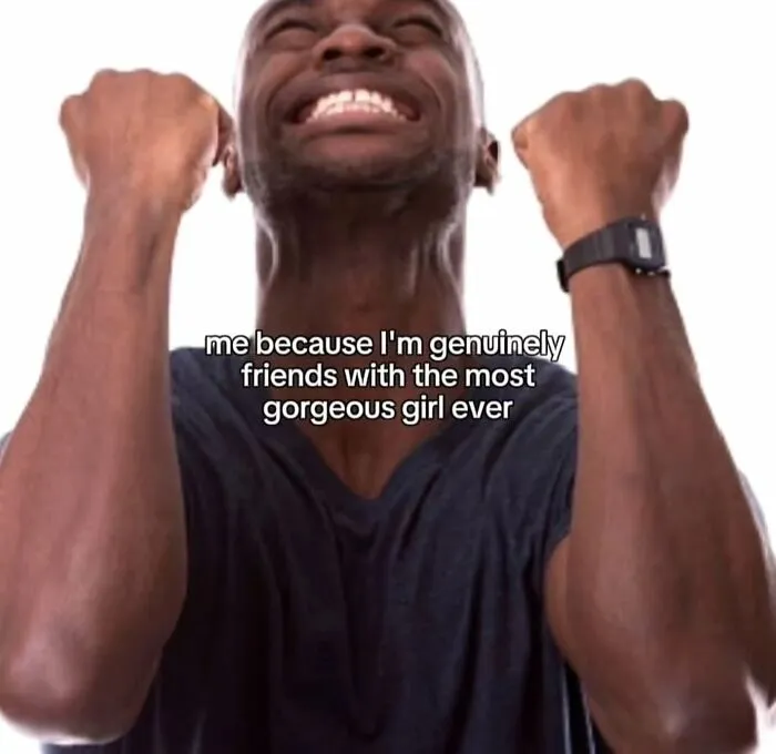 A man with closed eyes and clenched fists, smiling joyfully, with text about relatable memes: 'me because Im genuinely friends with the most gorgeous girl ever'.