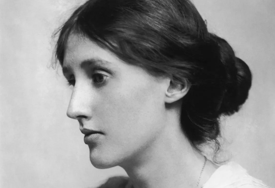 A black and white profile photo of Virginia Woolf, a prominent writer known for advocating financial independence and personal space for women.