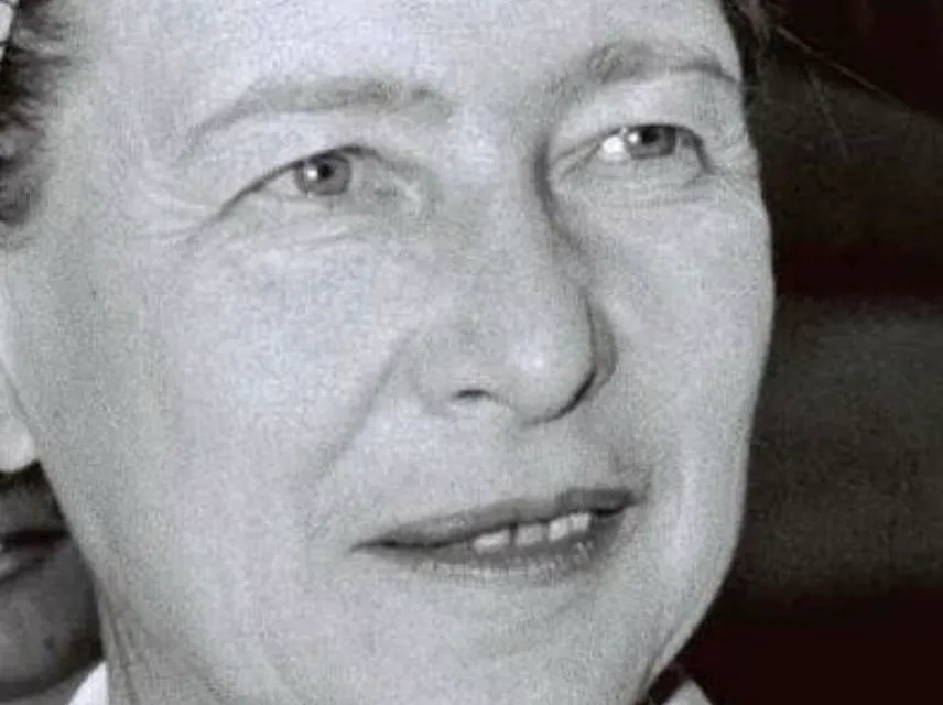 A black and white close-up of Simone de Beauvoir, an acclaimed writer who emphasized financial independence and personal space for women.