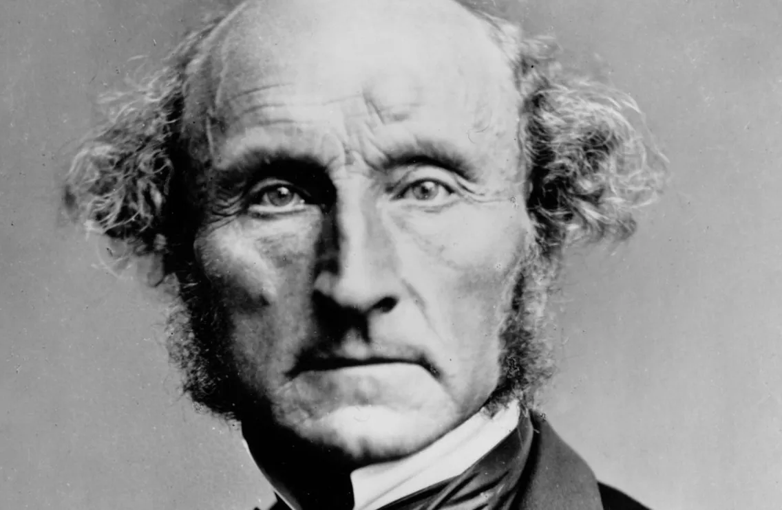 Black and white photo of John Stuart Mill, a key figure in the foundational text of feminism.