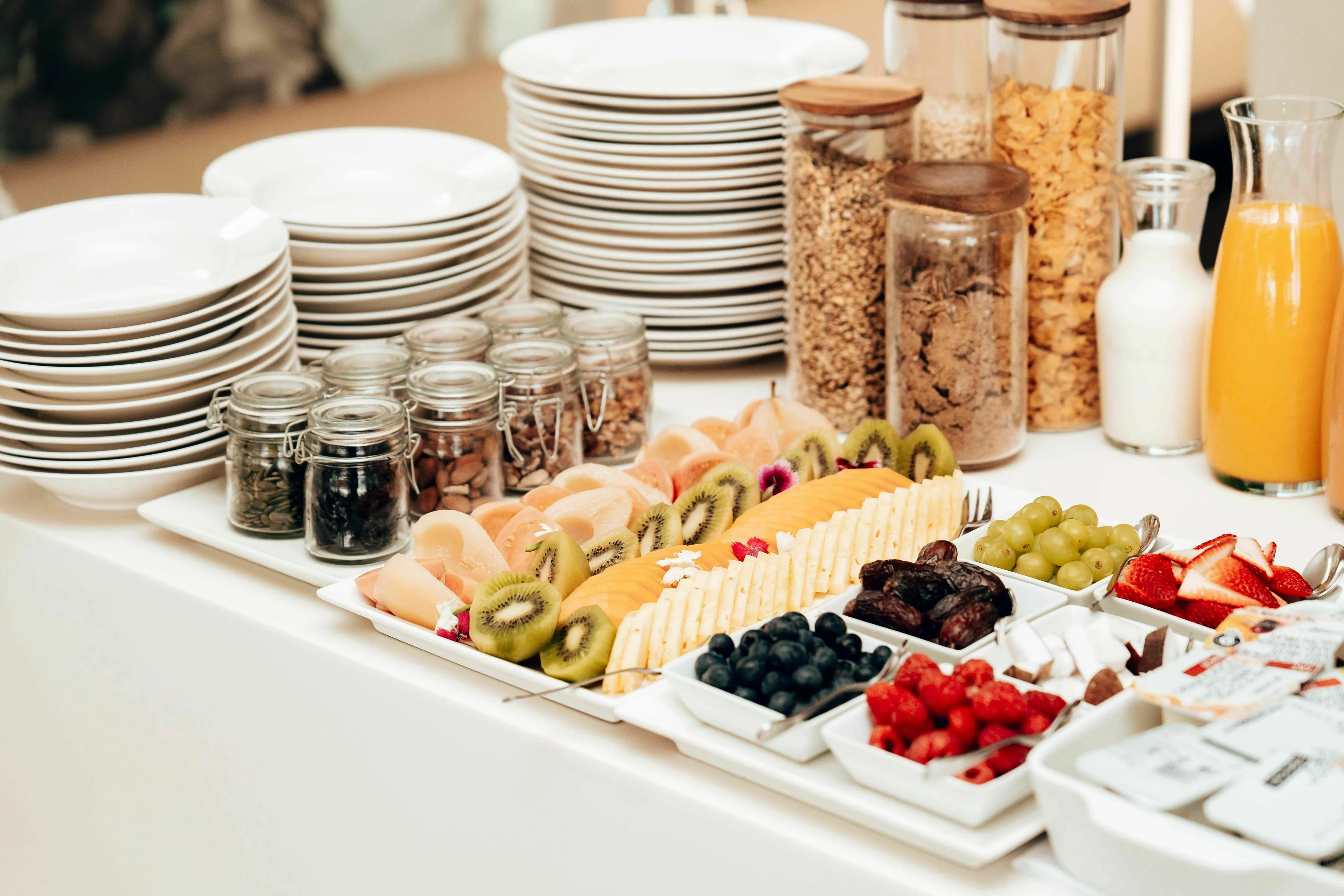 A wide selection of buffet food, including fruits, cereals, and drinks, for a risk taker to choose from.