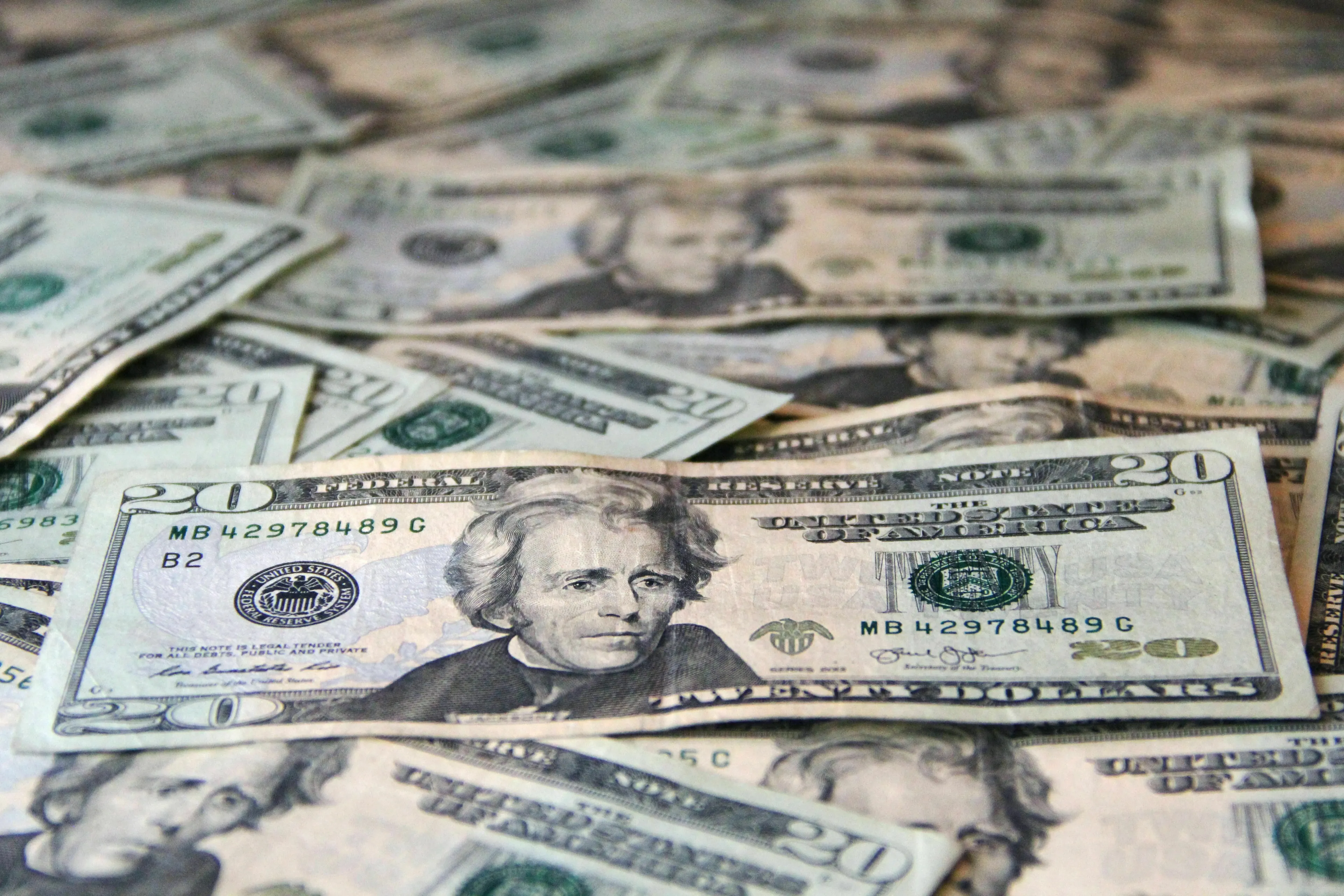 A pile of twenty-dollar bills, illustrating the scenario of finding money and what a risk-taker might do.