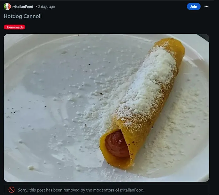 A hotdog rolled in a shell with powdered cheese showing a questionable food combo.