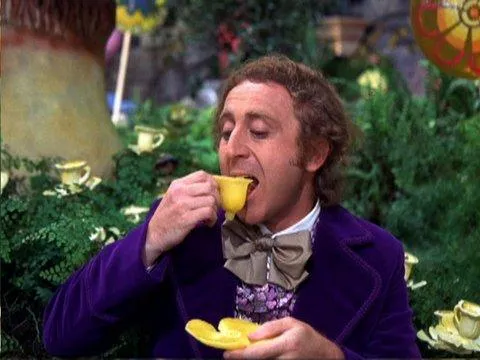 Willy Wonka drinking from a teacup, a whimsical figure to have by your side when you take a risk.