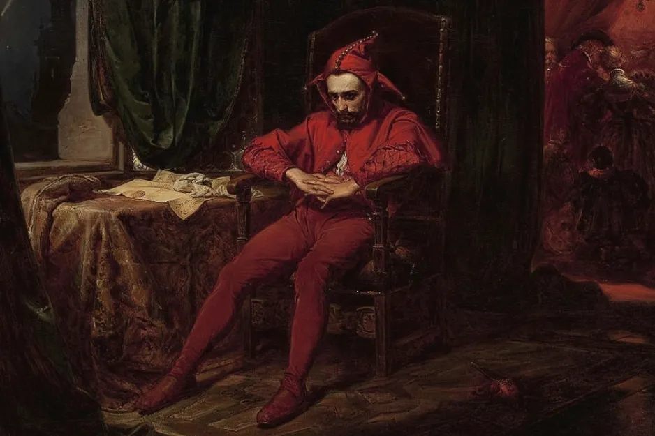 A sad medieval jester in a red costume sitting alone in a chair. A medieval profession you'd thrive in.