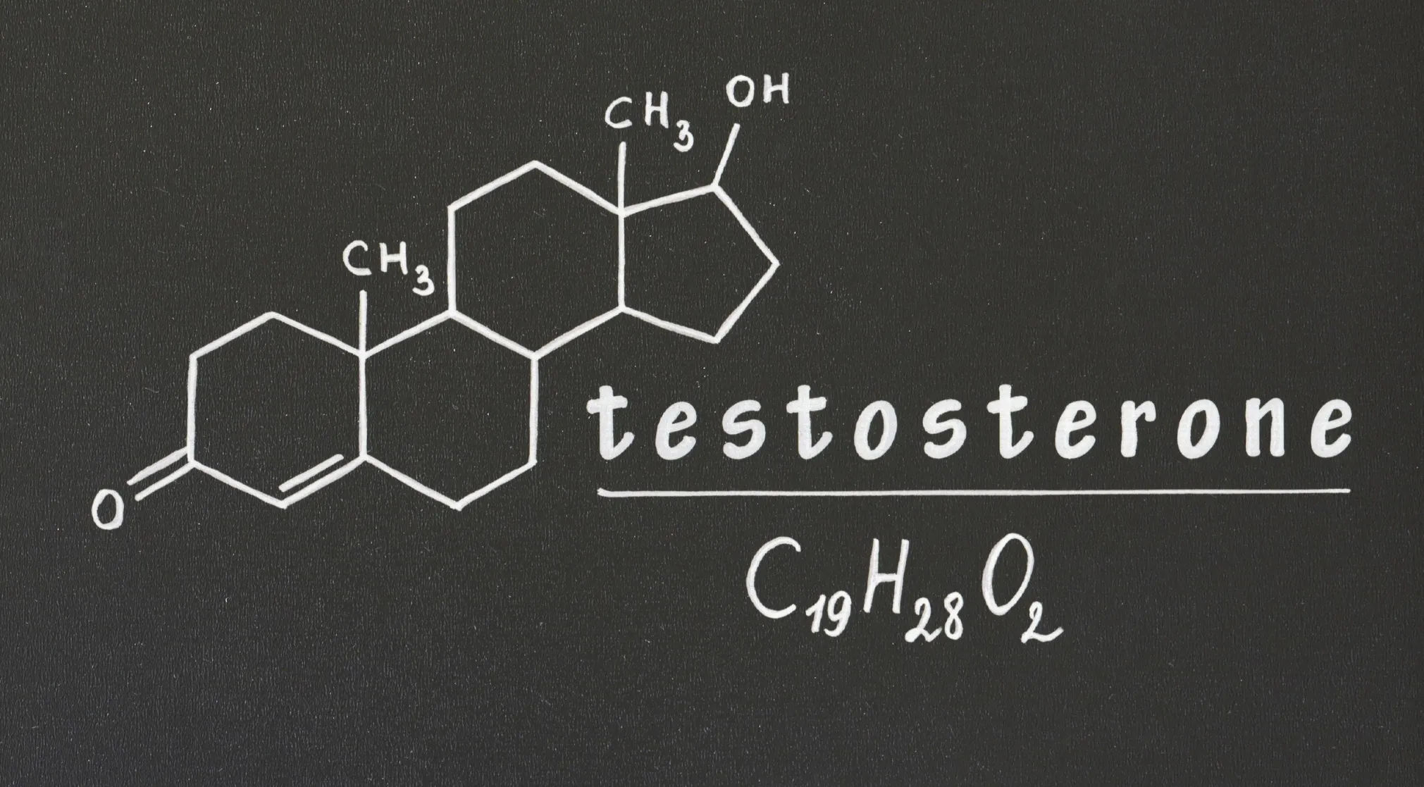 A white chemical structure of testosterone, C19H28O2, on a black background, representing a human body hormone.