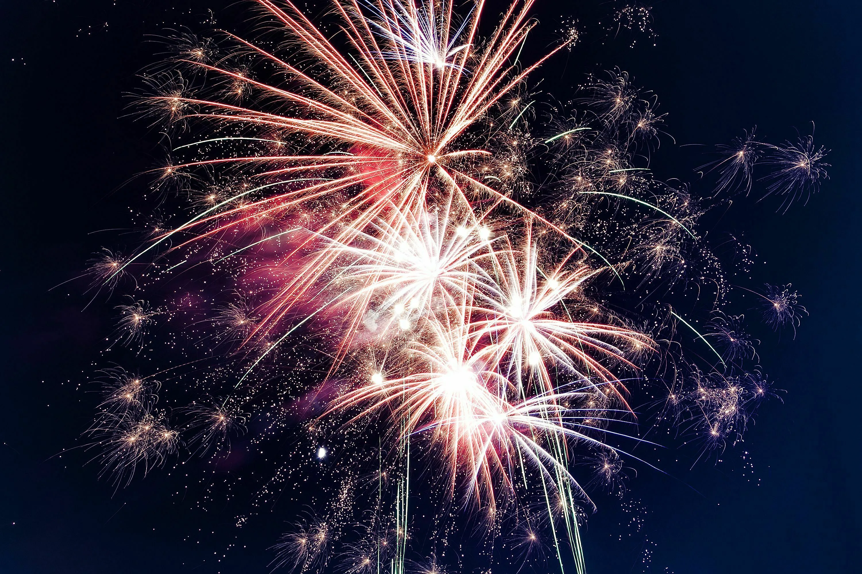 Colorful fireworks exploding in a dark night sky, showcasing where fireworks originate.
