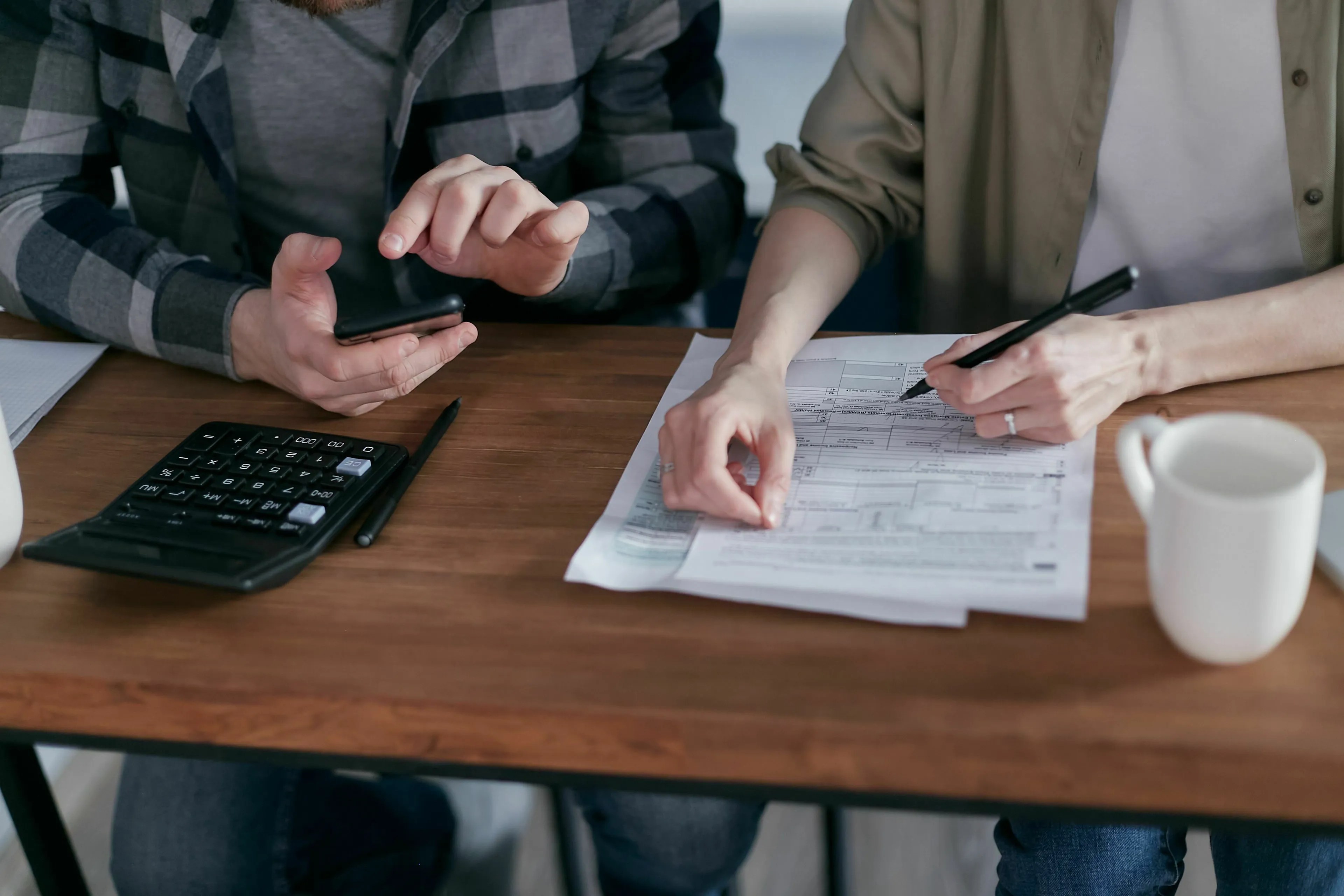 Three Letter General Knowledge Quiz: A couple completing their mandatory payment form, calculating taxes.