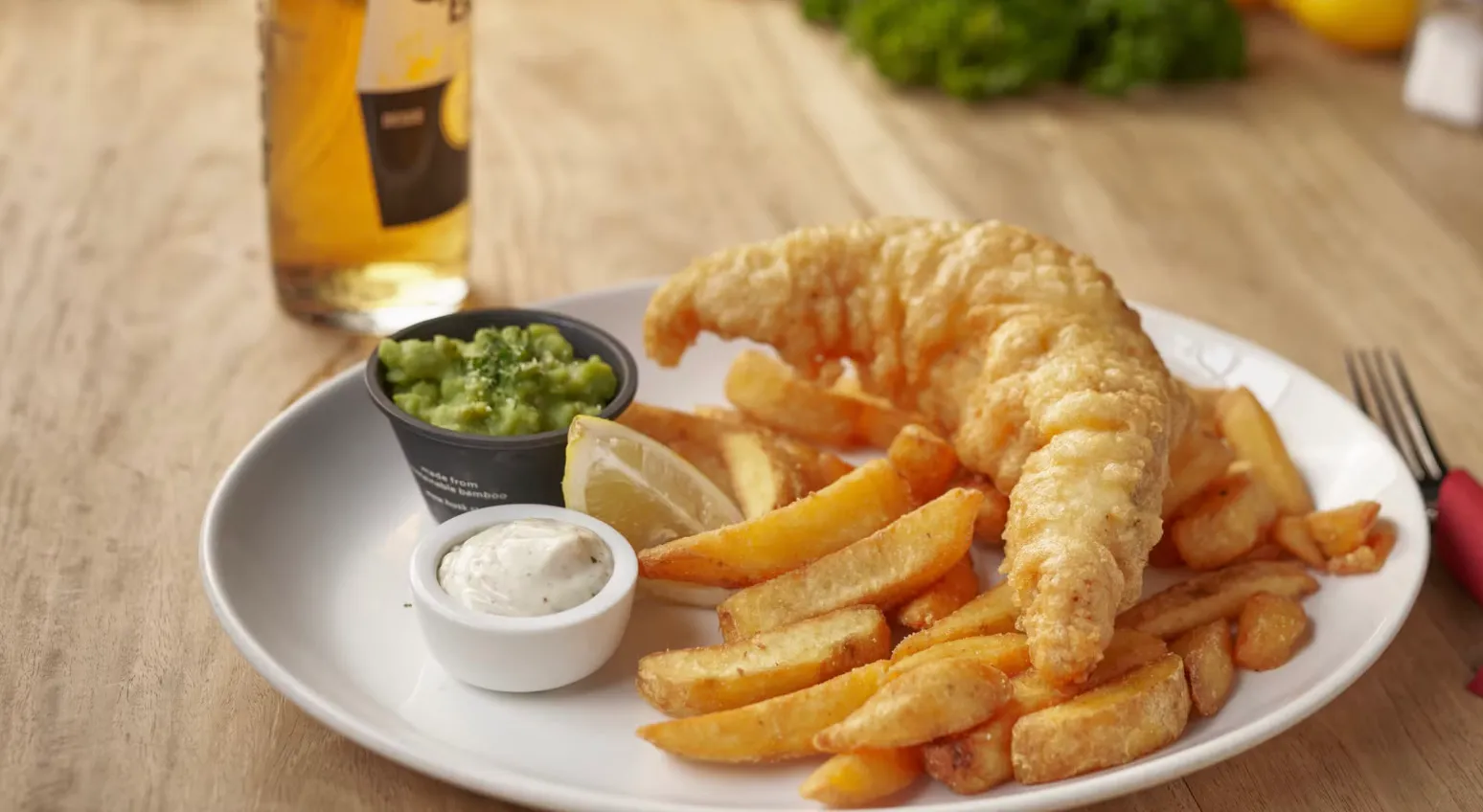 Three Letter General Knowledge Quiz: A plate of traditional fish and chips, with a glass of beer.