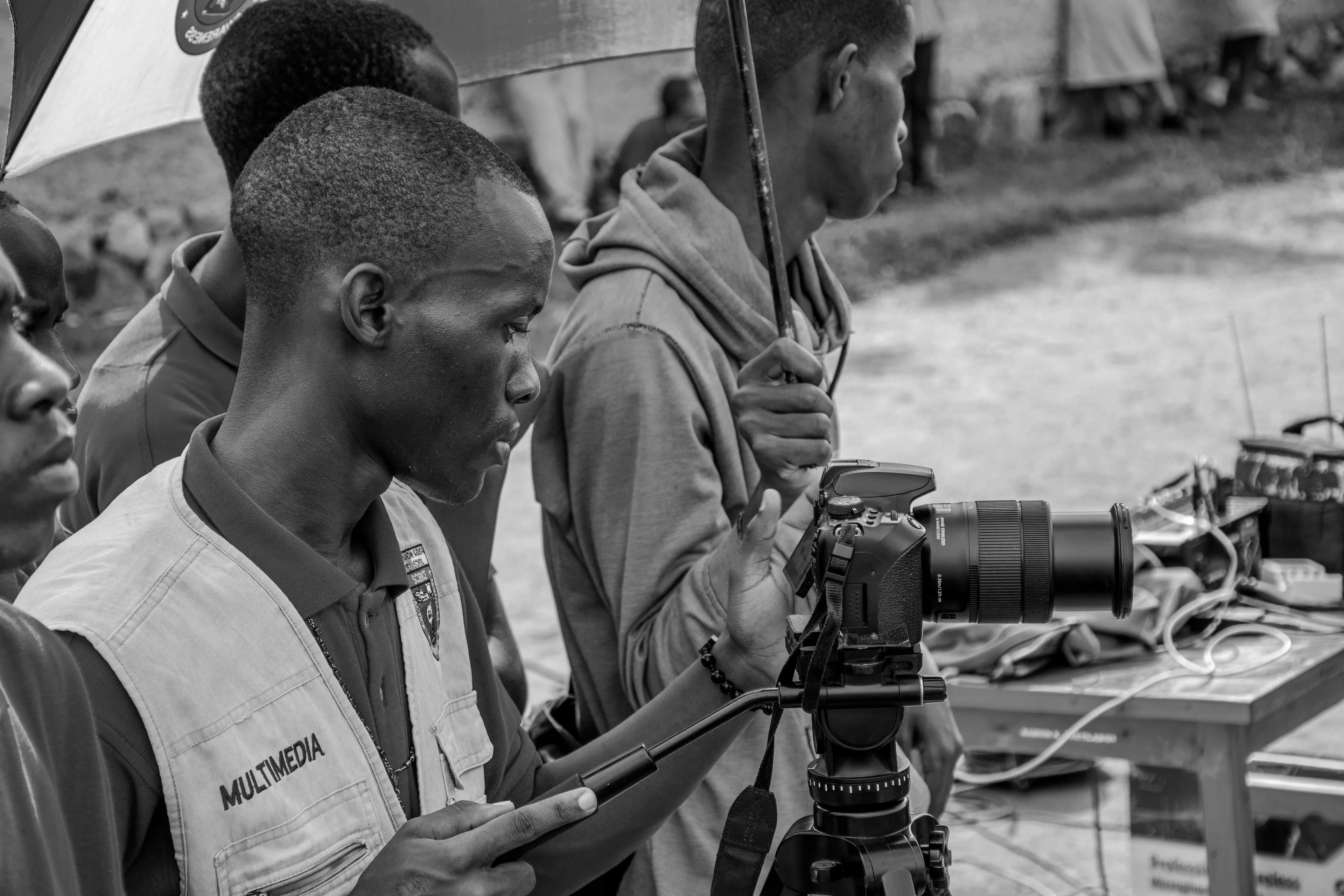 Conspiracy theory personality quiz: A person filming with a camera, symbolizing challenging beliefs with a documentary.