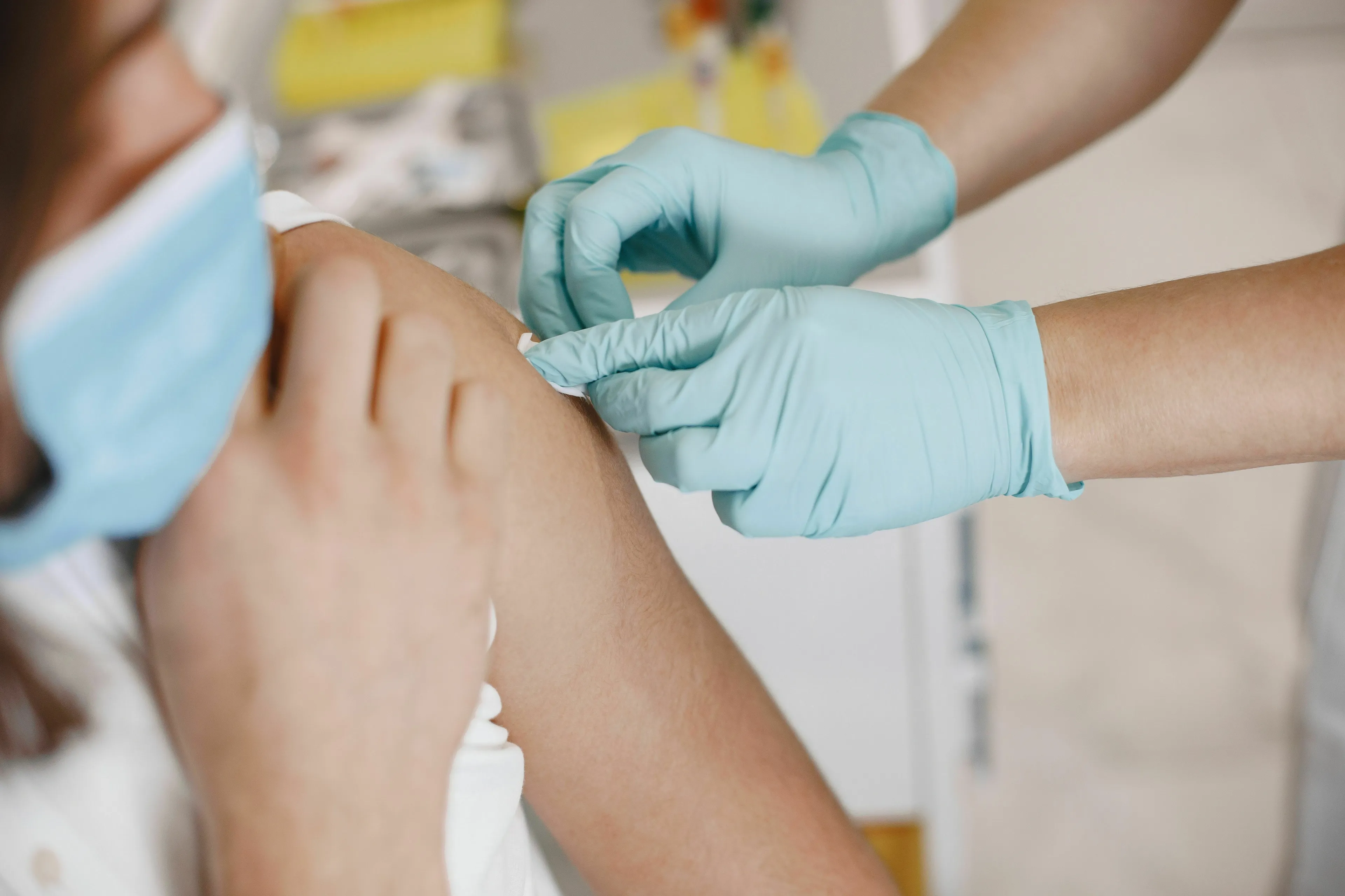 A nurse administers a childhood vaccine to a patient. This image relates to a conspiracy theory about vaccine recalls.