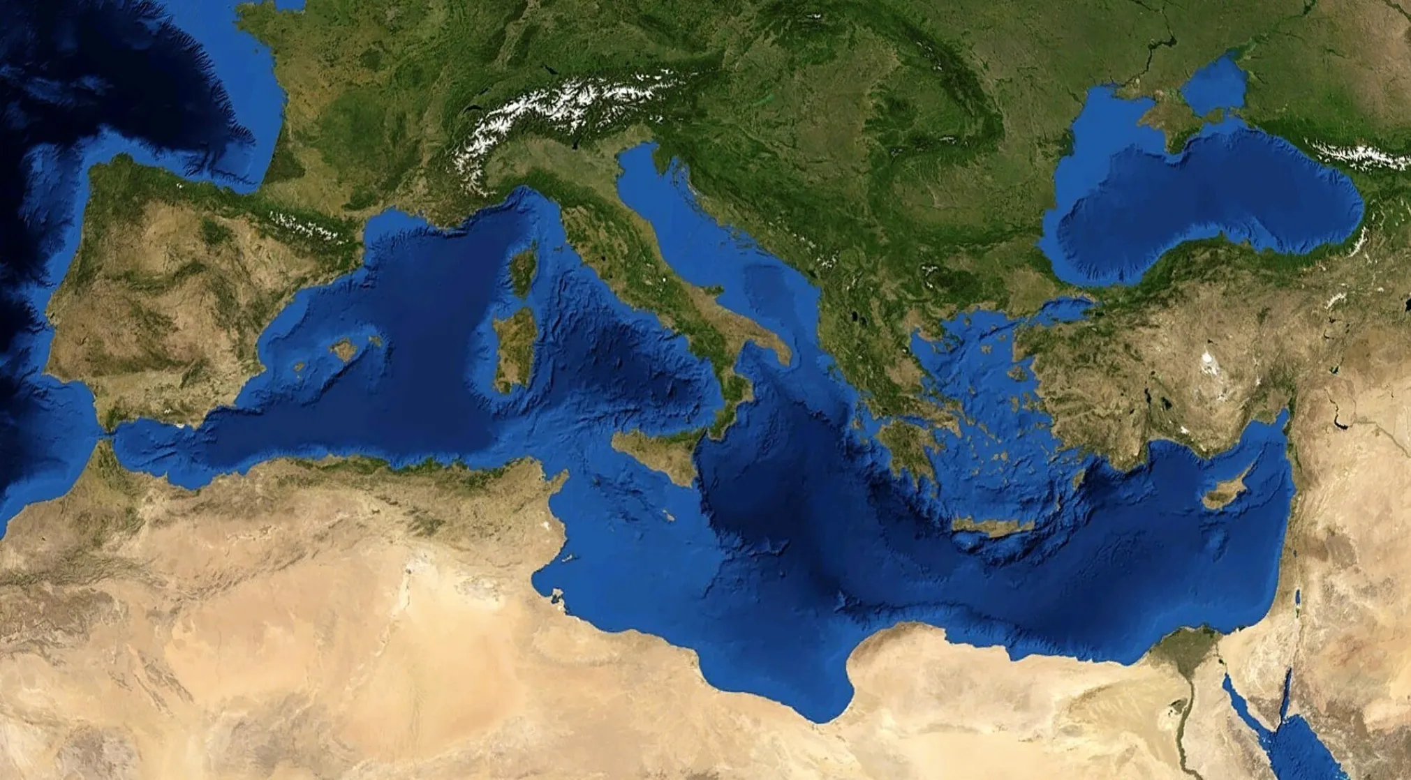 Satellite view of the Mediterranean Sea, which lies south of Europe, showing surrounding continents and landforms. General knowledge on Europe.