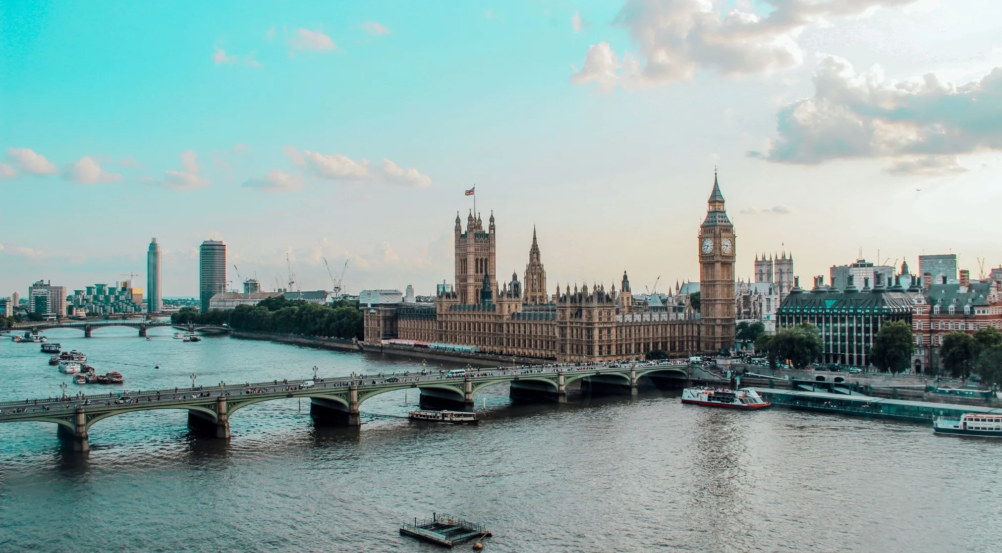 London cityscape with the Houses of Parliament and Big Ben along the river, providing General Knowledge on Europe.