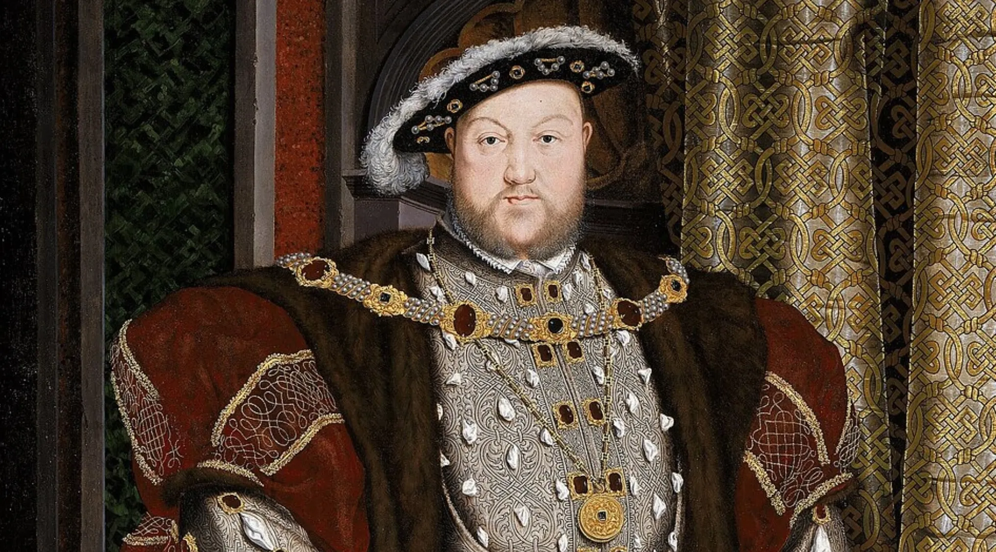 A historical painting of King Henry VIII, depicted in elaborate royal attire with a serious expression.