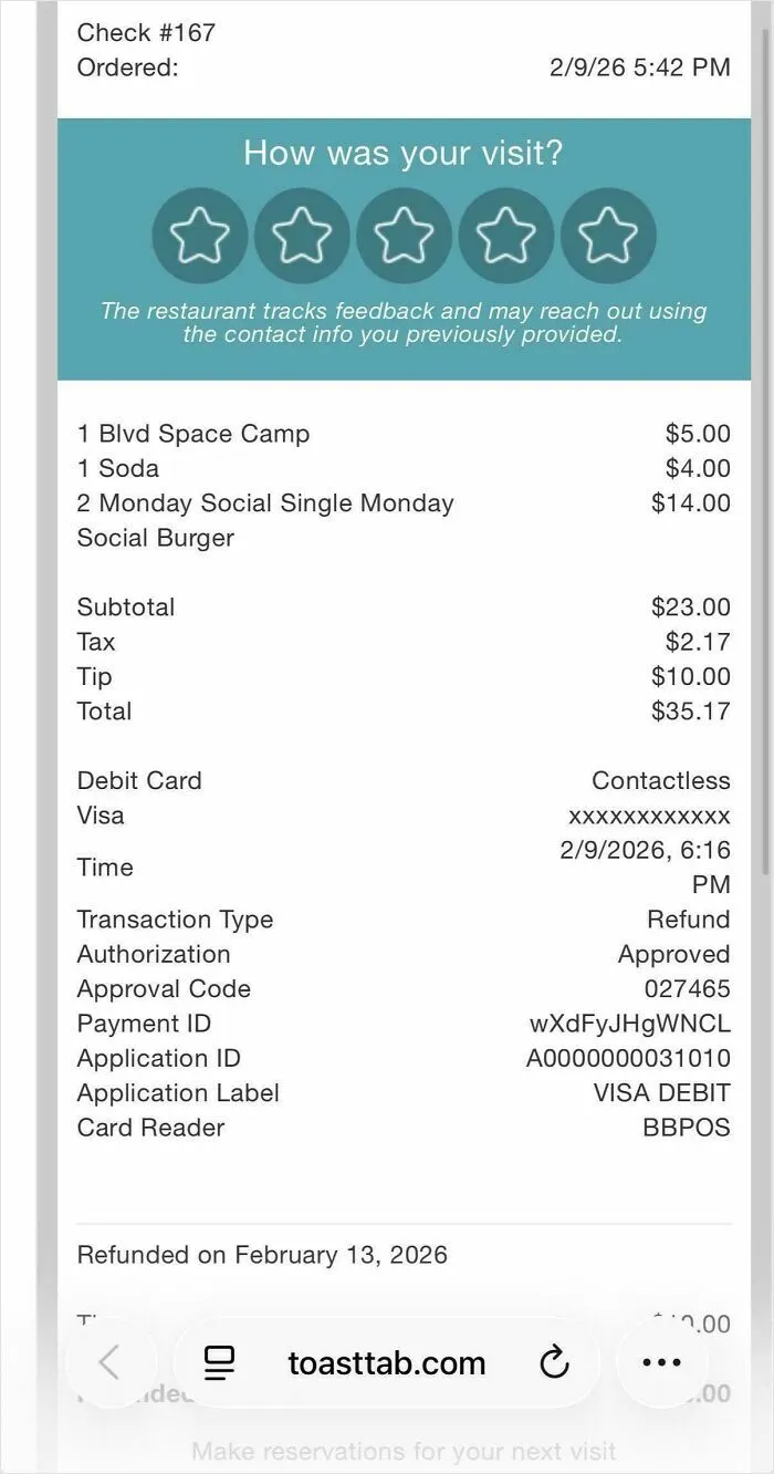 A receipt showing a $10 tip on a $23 subtotal, illustrating issues with tipping culture in the US.