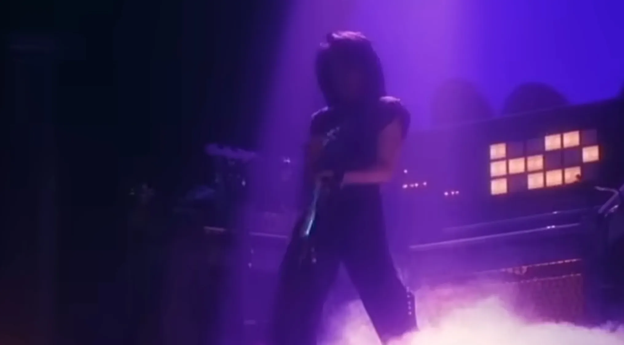 Multi-instrumentalist icon Prince performing Purple Rain on stage.